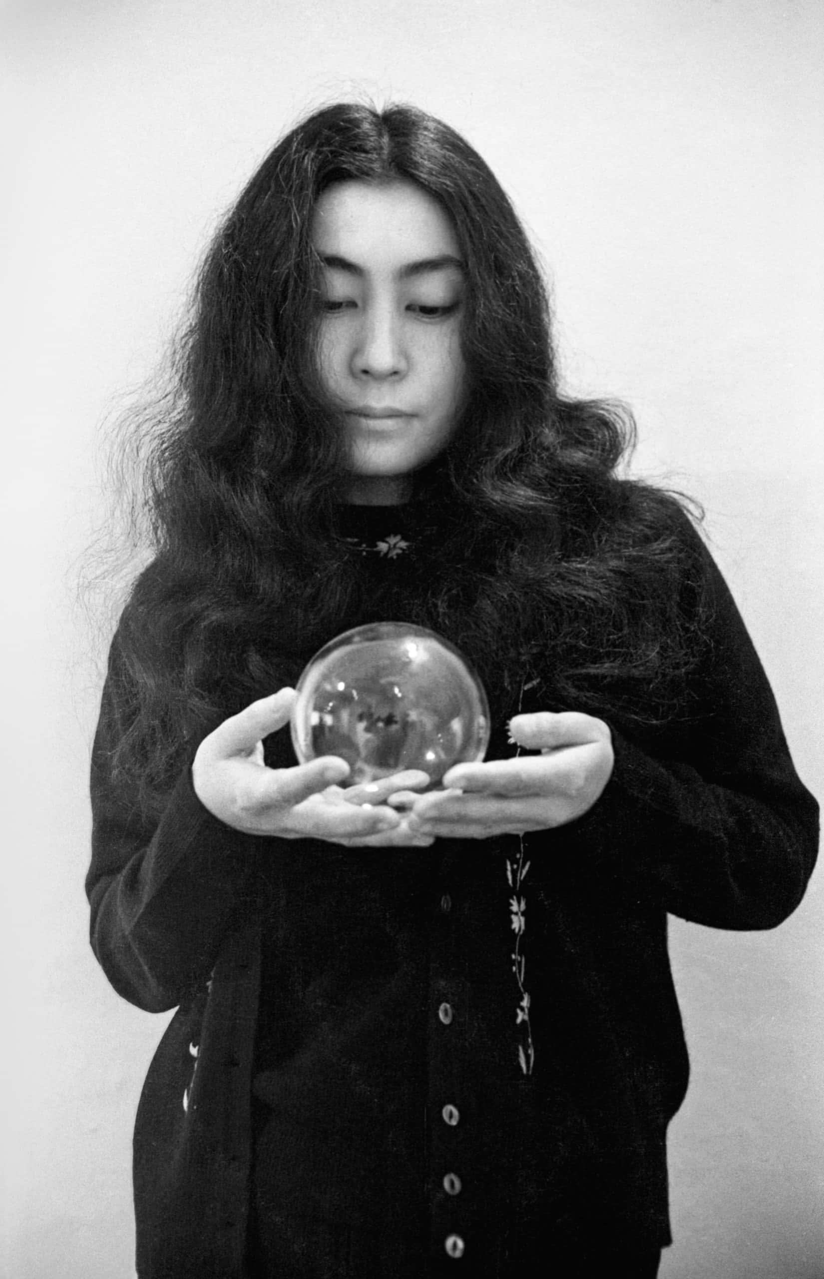 Yoko Ono, crystal ball, long dark hair, 2K Phone Wallpaper