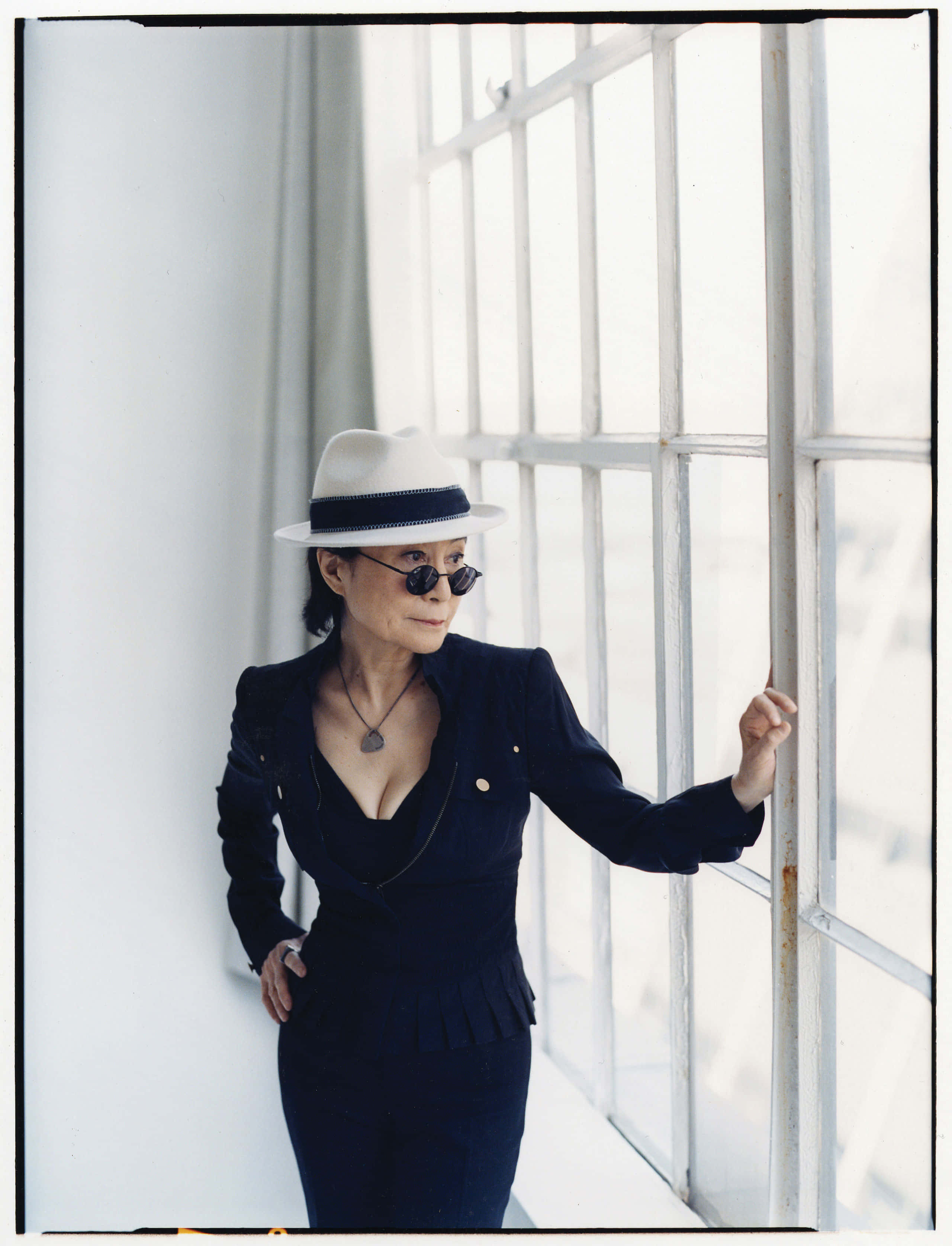 Yoko Ono, navy suit, white fedora, 2K Phone Wallpaper