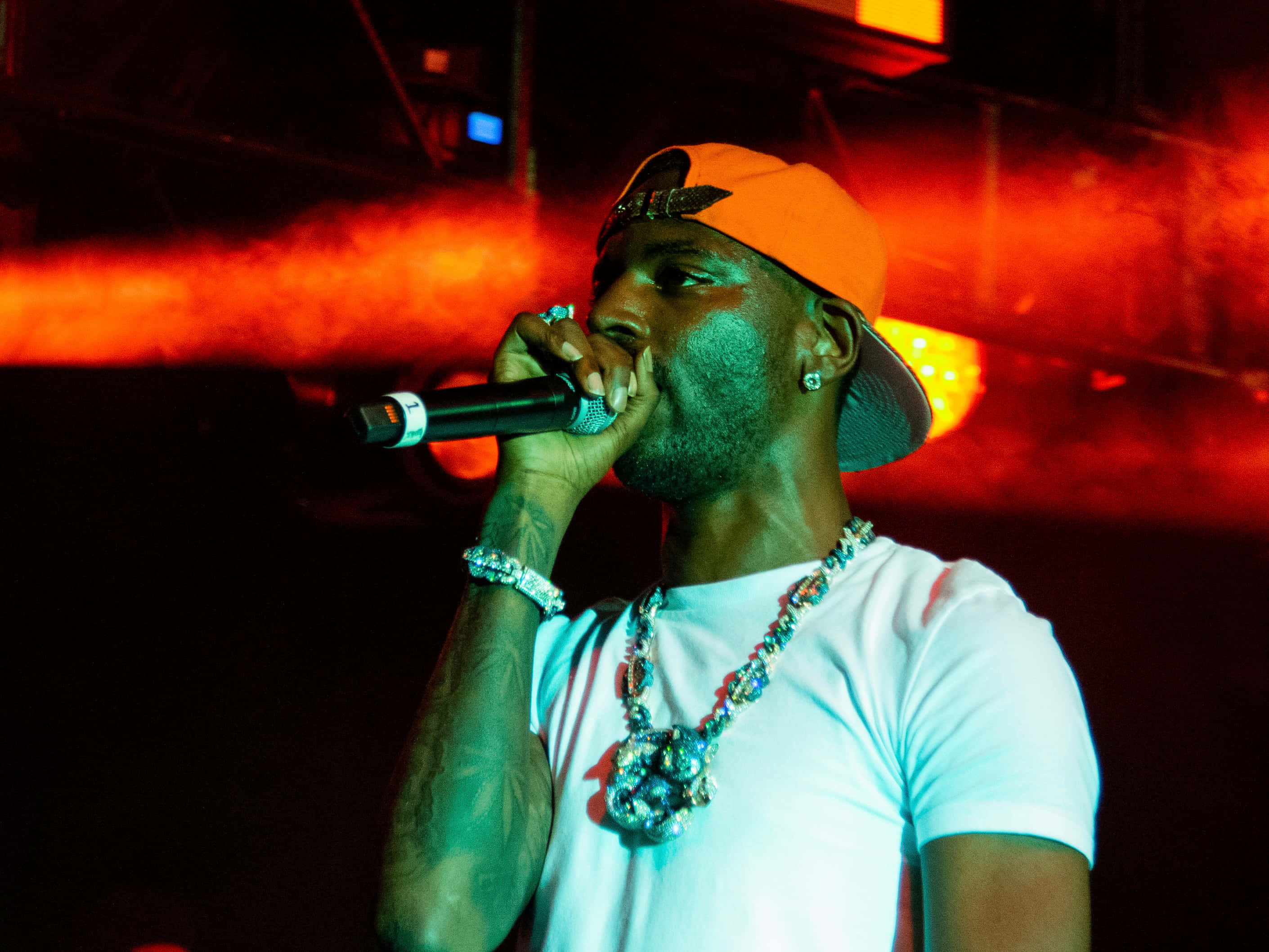 Young Dolph, orange hat, microphone, 2K Desktop Wallpaper