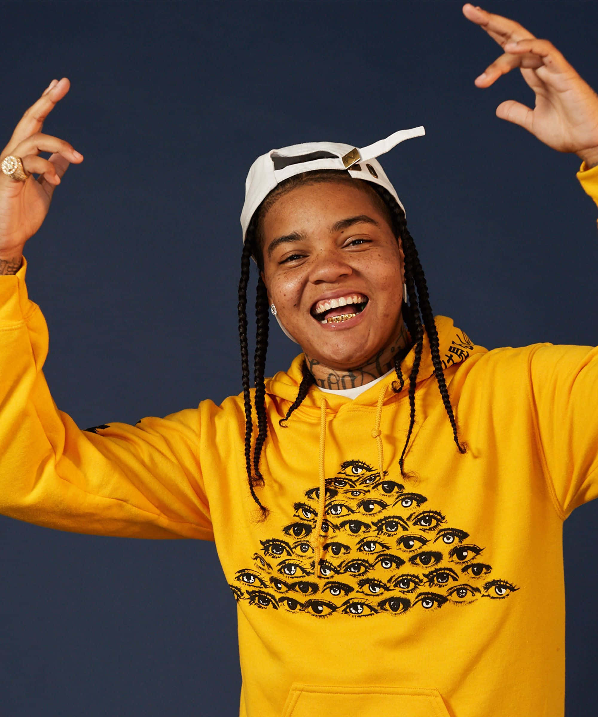Young Ma, bright yellow hoodie, eye pattern, Full HD Phone Wallpaper