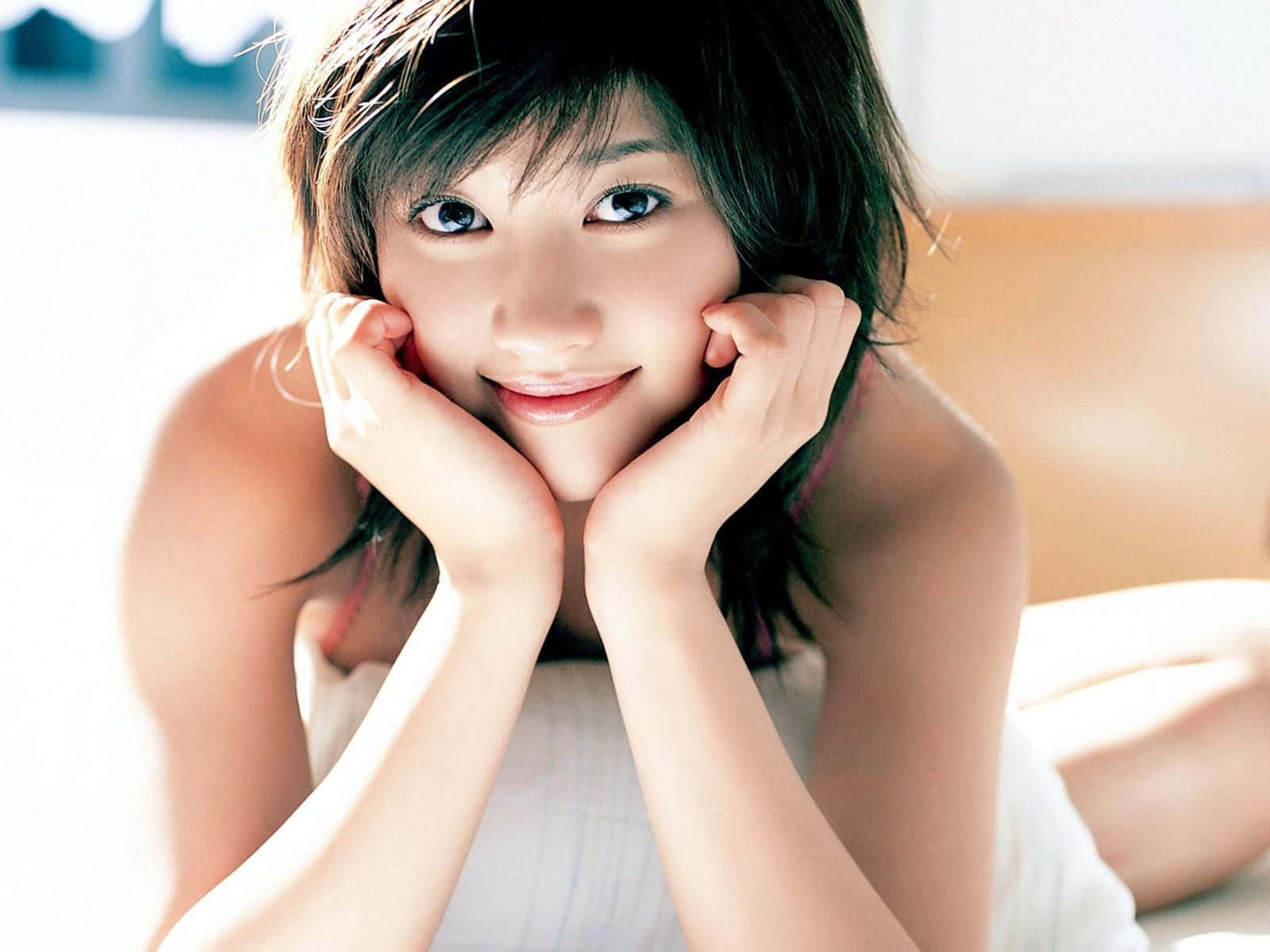 young female model, short dark hair, smiles warmly, HD Desktop Wallpaper