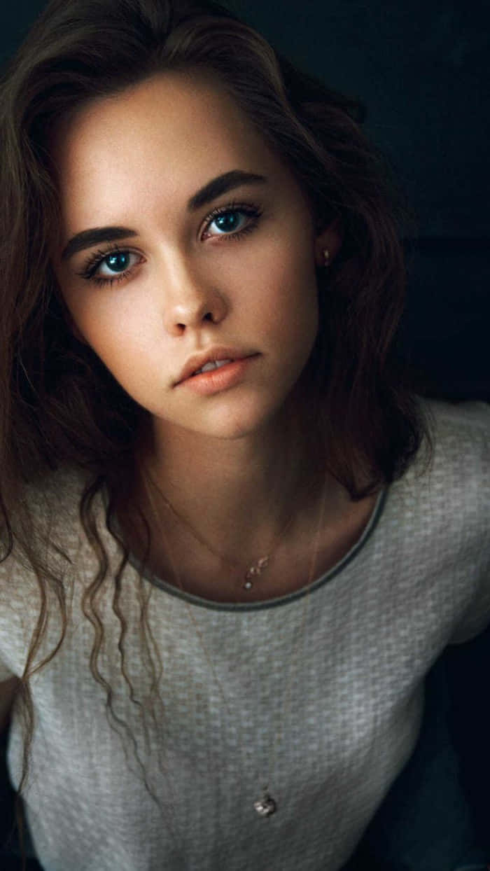 pretty teen serious girl, young woman, striking blue eyes, SD Phone Wallpaper