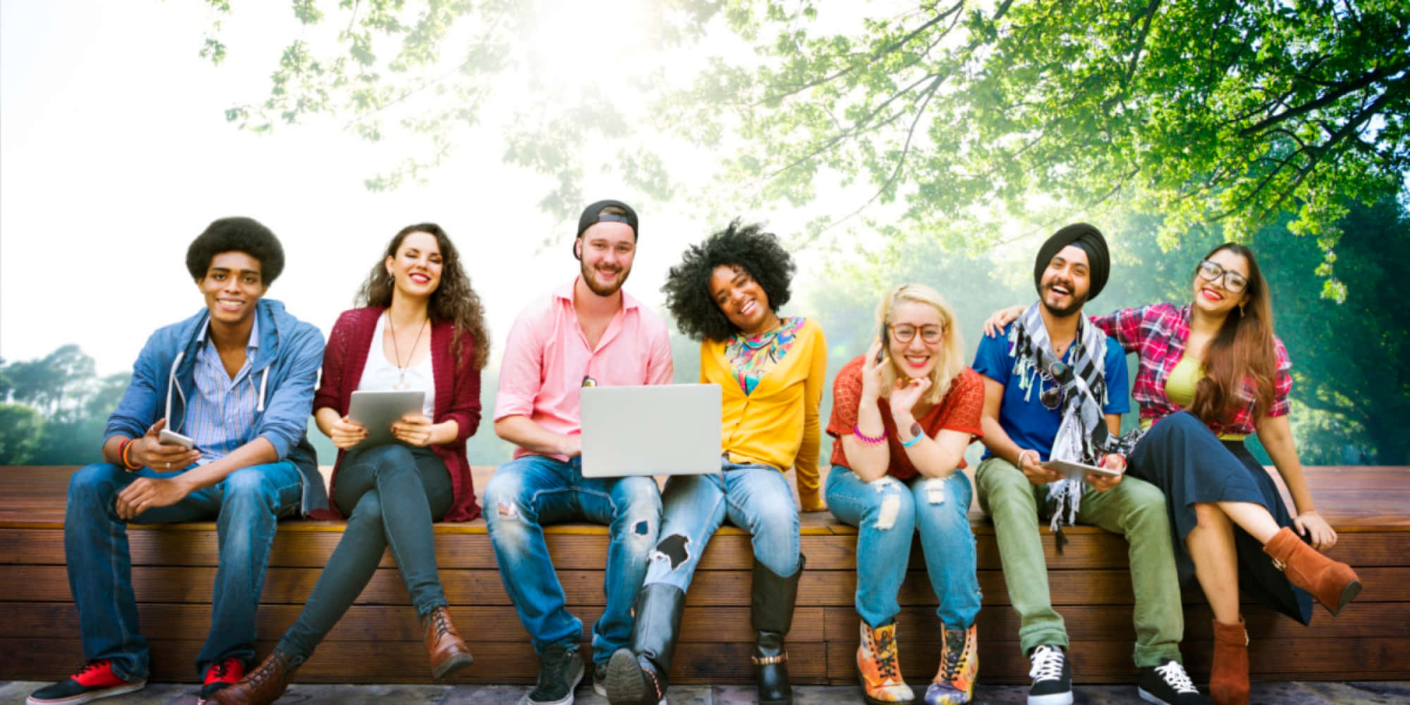 diverse youth group, wooden bench, leafy trees, Full HD Desktop Wallpaper
