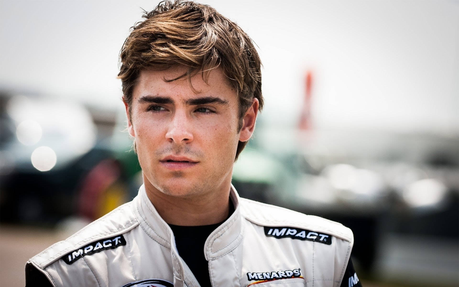 Zac Efron, white Impact racing suit, garage, Full HD Desktop Wallpaper