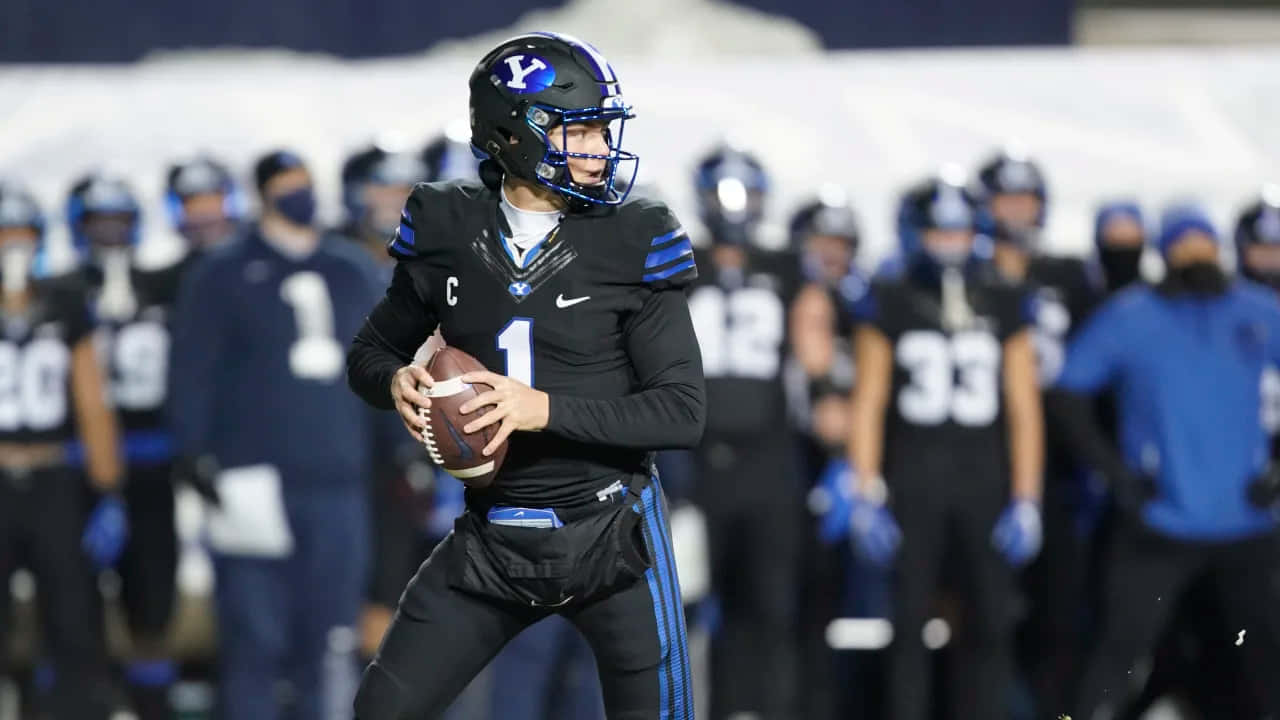 Zach Wilson, football quarterback, black and blue uniform, HD Desktop Wallpaper