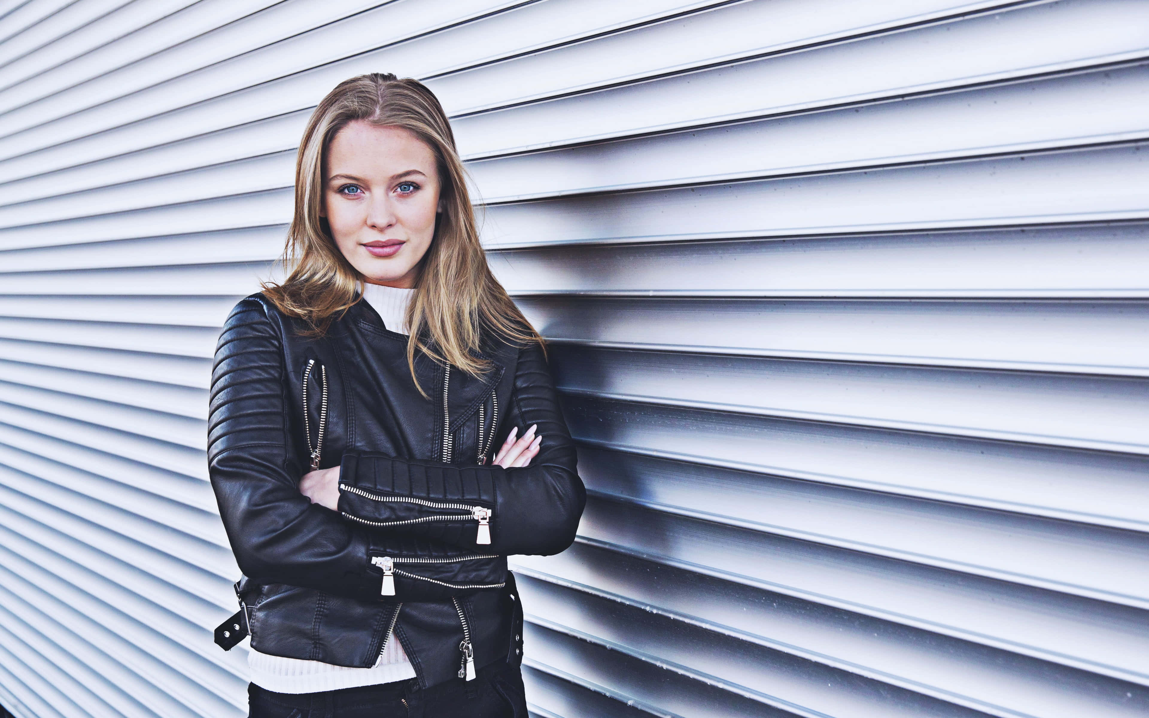 Zara Larsson, black leather jacket, sleek silver corrugated metal wall, 4K Desktop Wallpaper