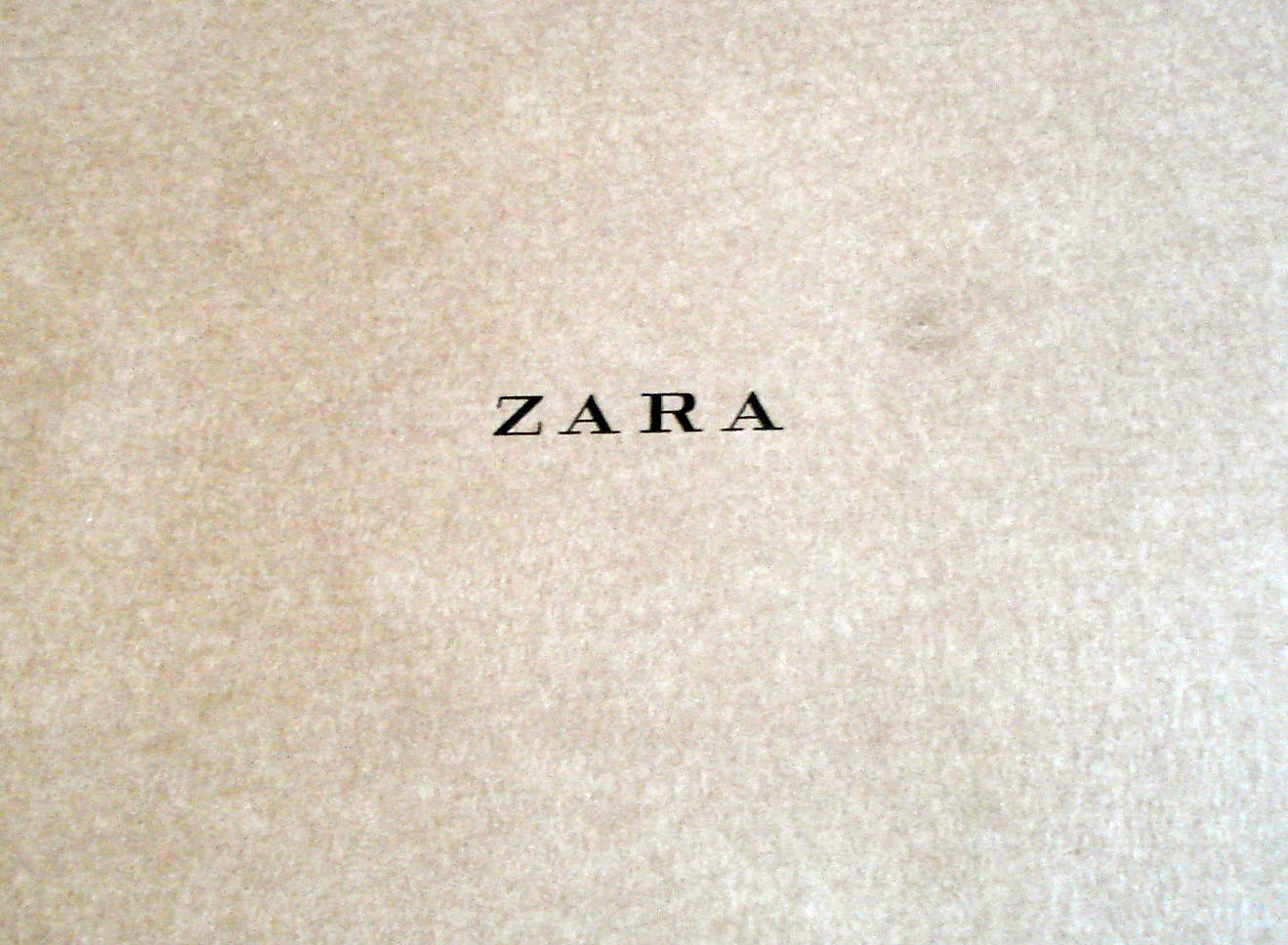 Zara, beige textured surface, black serif font, HD Desktop Wallpaper