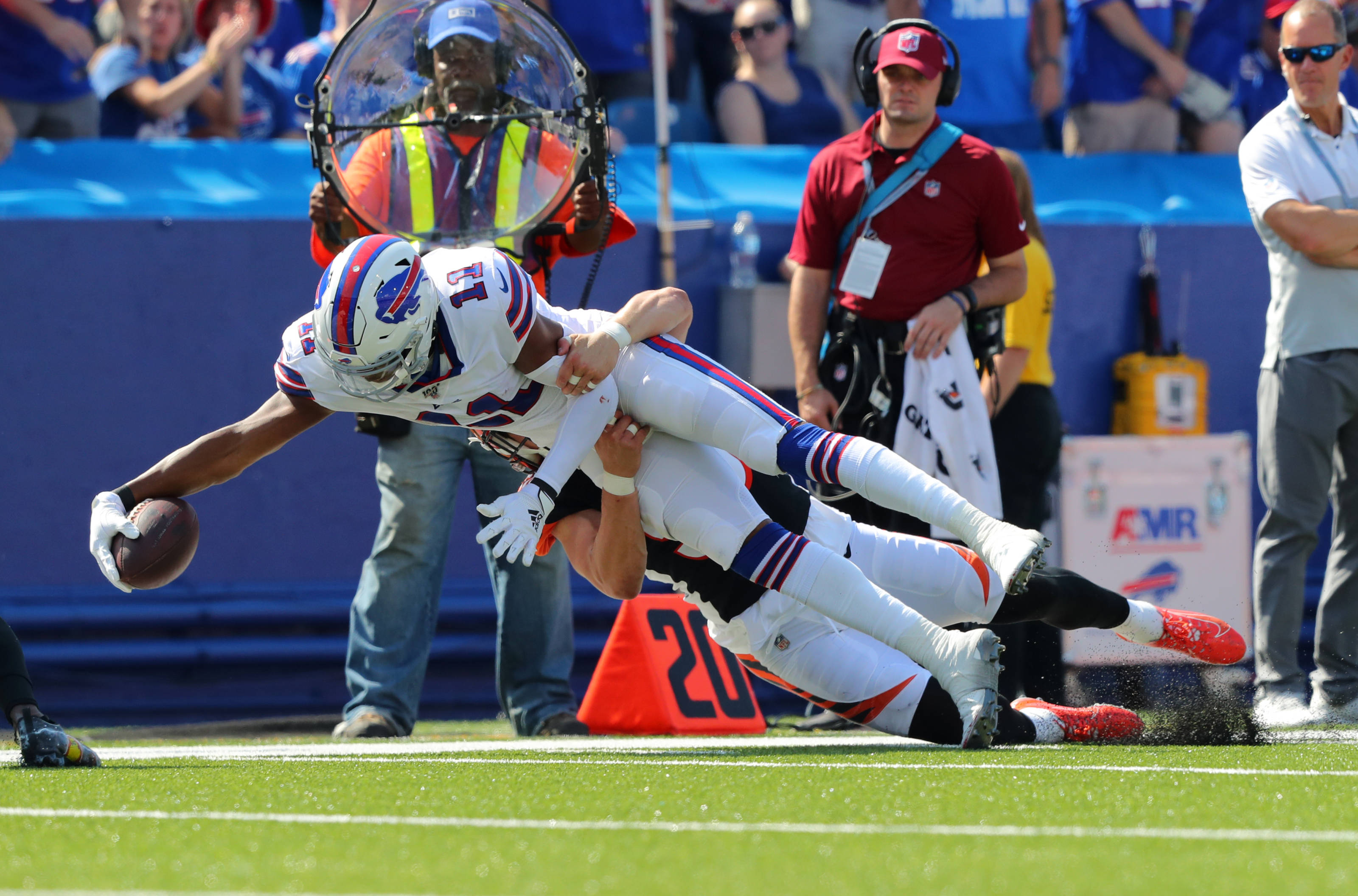 Zay Jones, tackled mid-air, white uniform, 2K Desktop Wallpaper