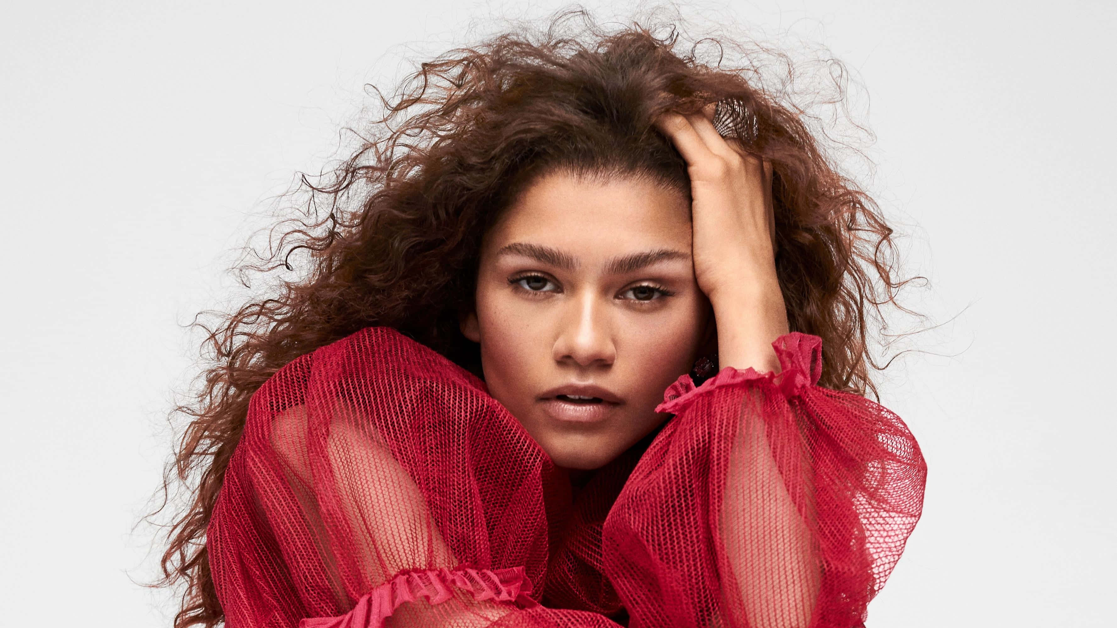 Zendaya, curly brown hair, sheer red blouse, 2K Desktop Wallpaper
