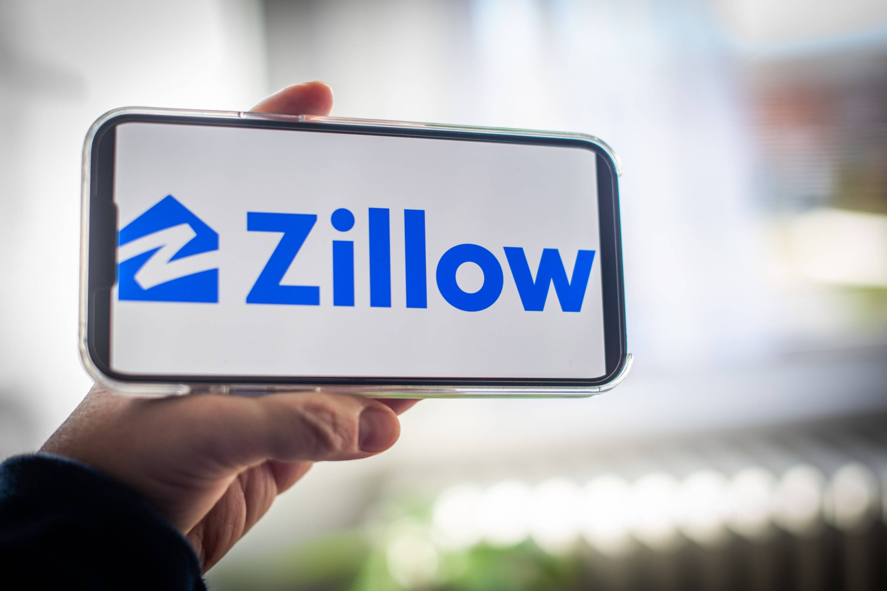 Zillow logo, smartphone, blue, 2K Desktop Wallpaper