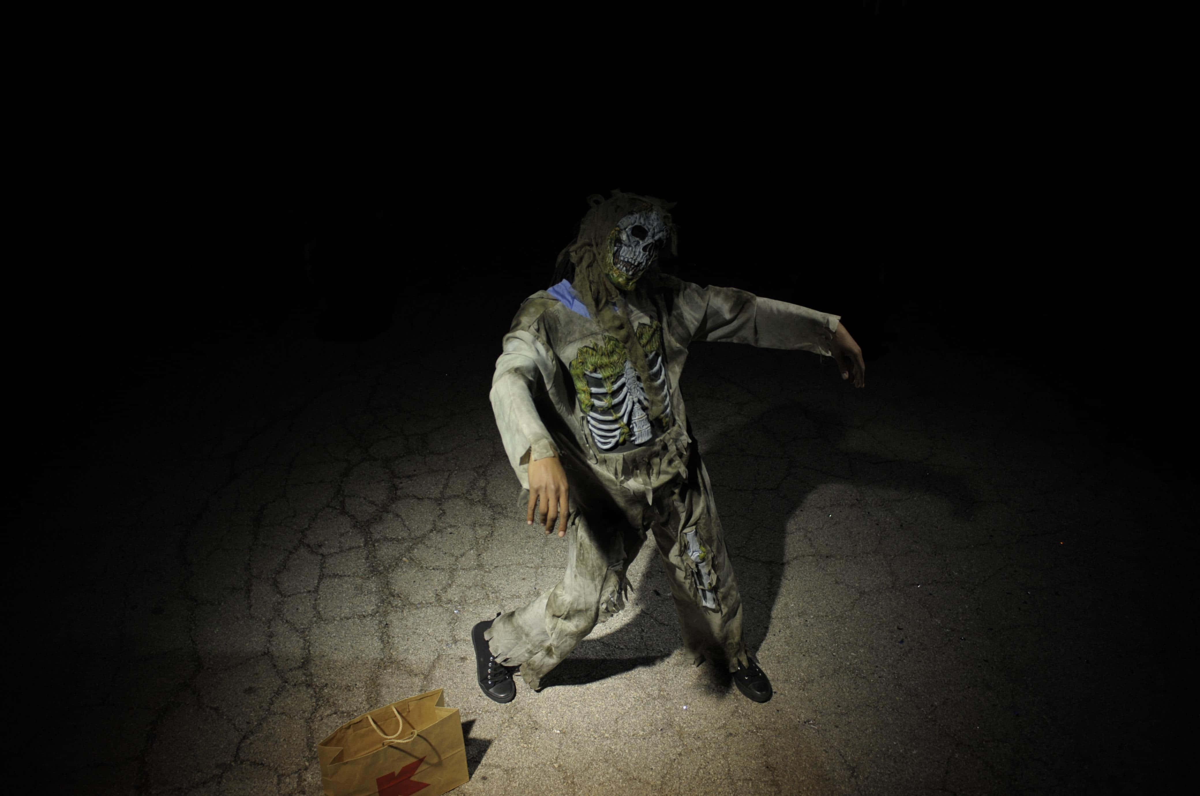 zombie costume, cracked pavement, spotlight, 4K Desktop Wallpaper