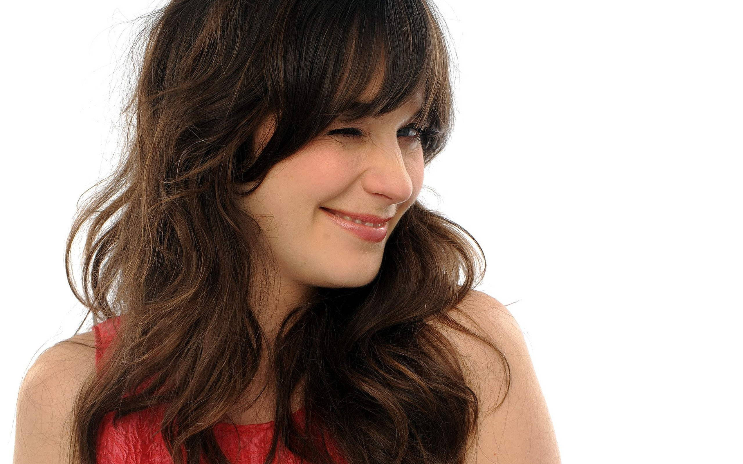 Zooey Deschanel, wavy brown hair, red top, 2K Desktop Wallpaper