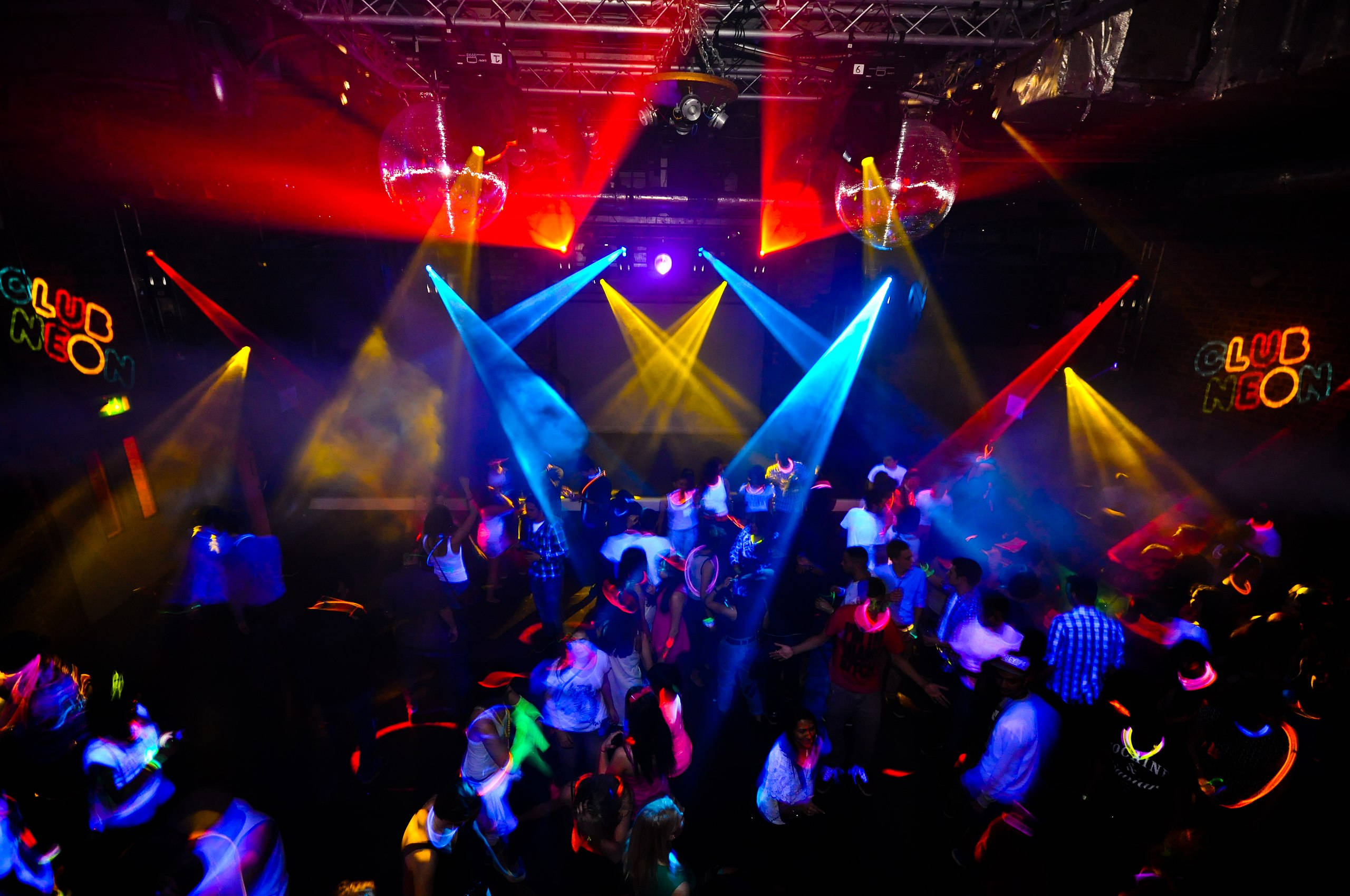 Glow Stick Party Club Background, neon-lit nightclub, disco balls, 2K Desktop Wallpaper