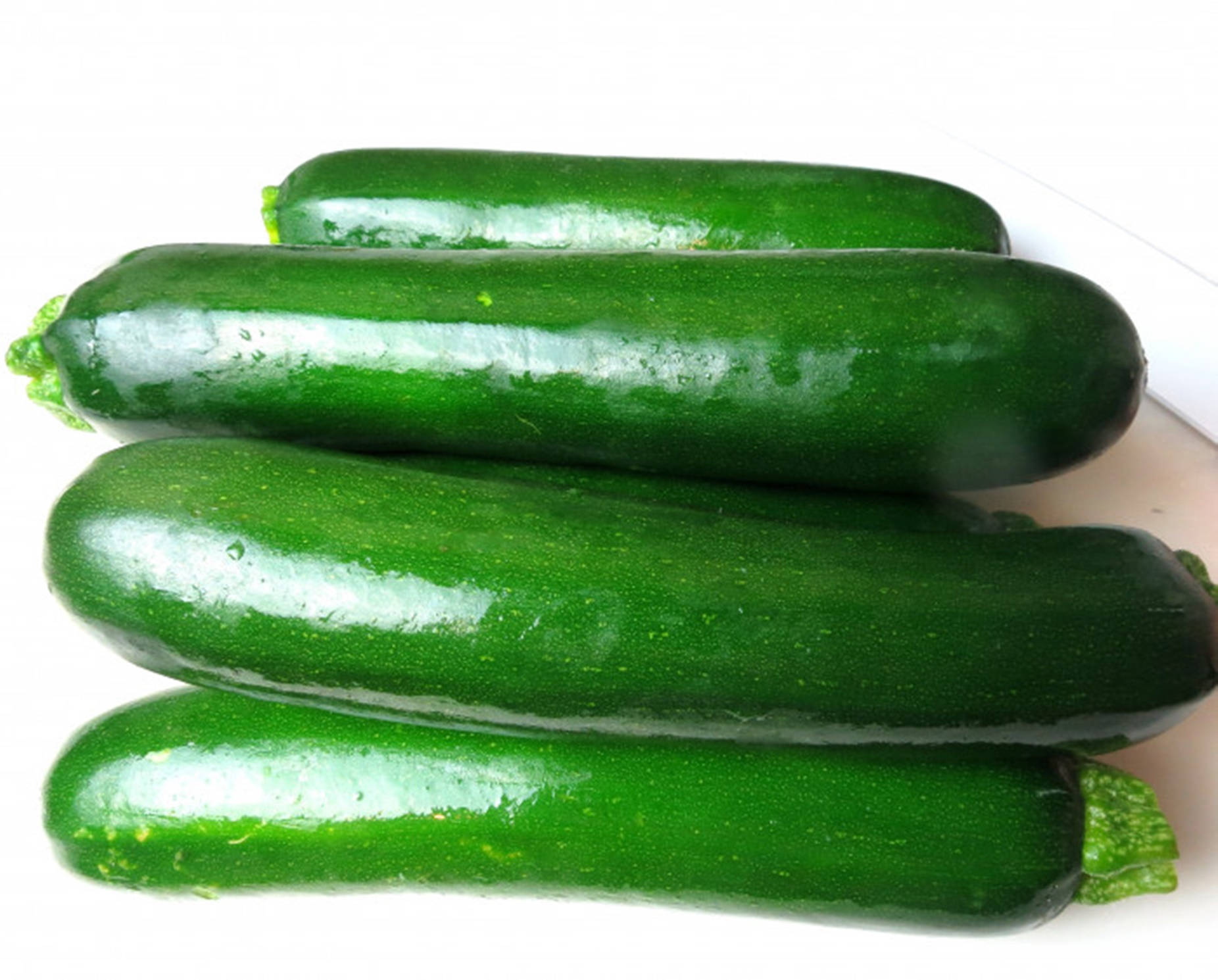 shiny green skins, glossy green zucchinis, white surface, HD Desktop Wallpaper