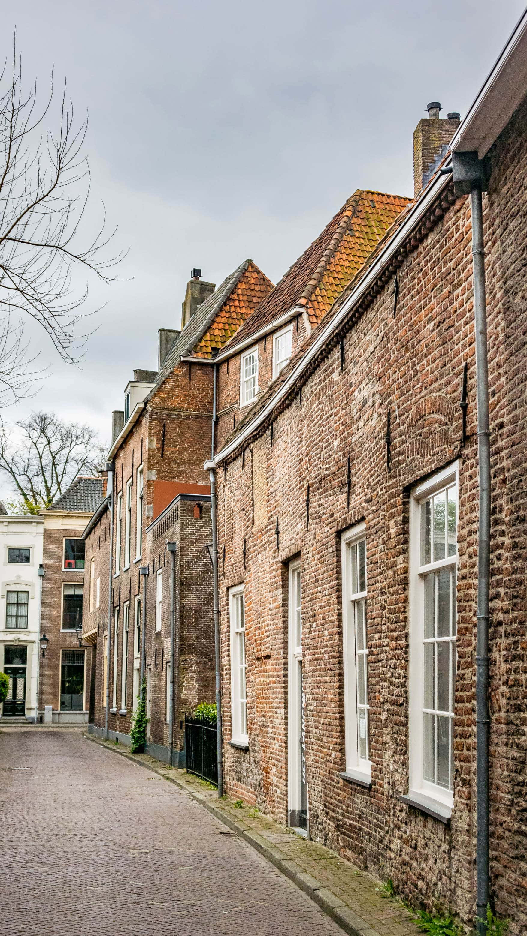 Zwolle, historic brick buildings, cobblestone alley, 2K Phone Wallpaper